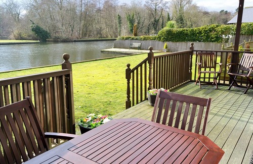 Wroxham Cottage | Imagine relaxing on the patio, watching the boats and river life pass by.