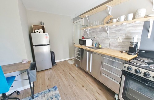 Norway Apartment | In unit laundry. AC, Modern Studio with desk and parking