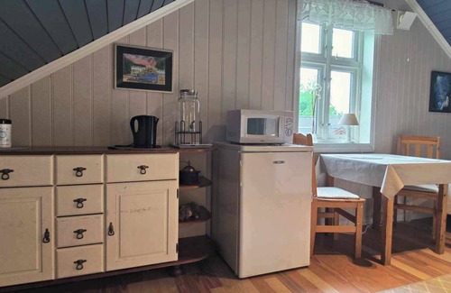 Sarpsborg House | Island house room Shared entrance with hosts Two single beds + sofa bed Small kitchen