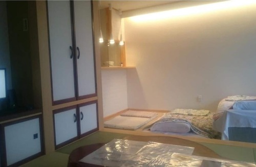 Goshogawara House | Japanese and Western style modern suite apartment / Goshogawara Aomori
