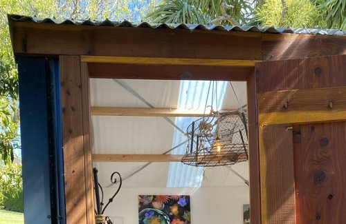 Kakanui Cabin | Kakanui Boatshed - FUNKY WEE GLAMPING CABIN: cosy for two.