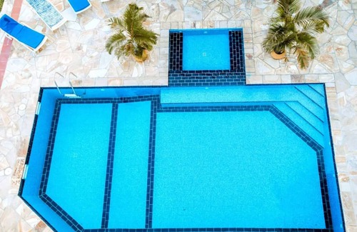 Upanga East Villa | Karibu Beach Villa - A private beach front home with a large pool and gardennn