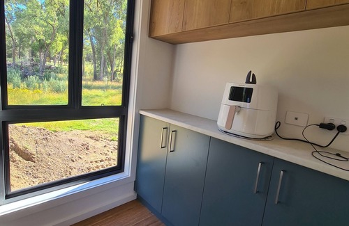 Khancoban House | Khancoban Getaway. Modern 3-bedroom home backing onto 9-hole golf course.