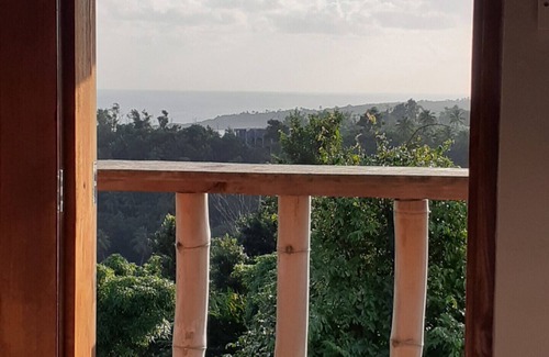 Calibishie Cottage | Kiki's Nature Cabin - studio style cottage with a stunning view