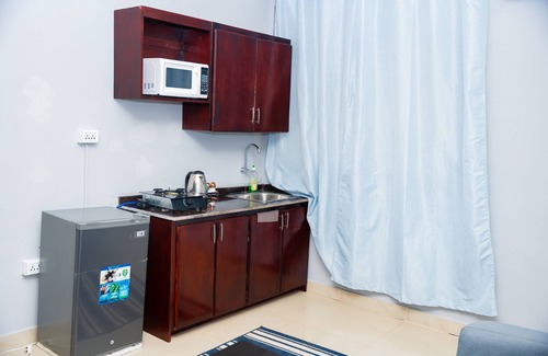 Margibi County Apartment | King Studio Suite with kitchen and Sofa.