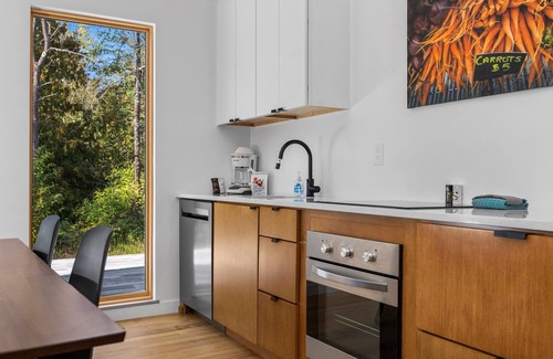 Acme Cabin | KOTI 1 (Two Bedroom) Traverse City's Scandinavian Cabins, vacation home on TART & mins to Traverse C