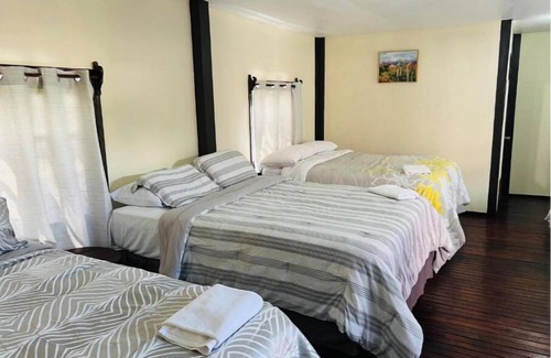 Corozal House | La Delphina Bed and Breakfast Bar and Grill Deluxe Family Room