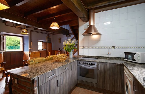 Llamigo Apartment | La Rotella de Xuan: Apartment 'Azul' with Mountain View, Private Terrace and Shared Garden