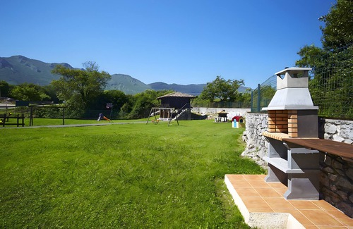Llamigo Apartment | La Rotella de Xuan: Apartment 'Azul' with Mountain View, Private Terrace and Shared Garden