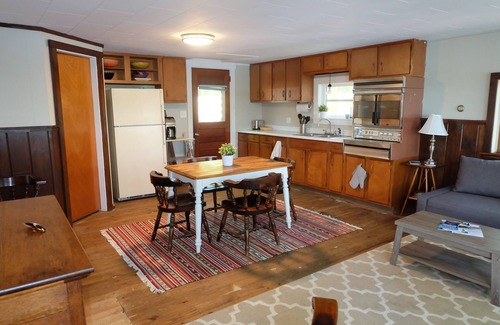 North Jay Cottage | Lake House with Swim Area, Dock, Deck, Canoe, & Paddle Boat - 1BR+, Sleeps 4-6