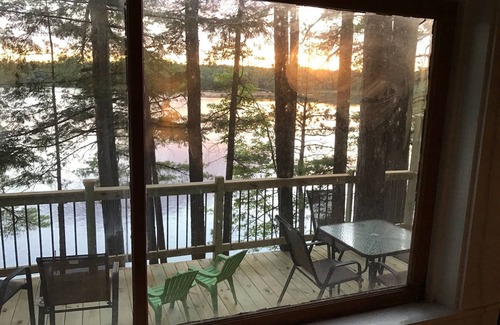 North Jay Cottage | Lake House with Swim Area, Dock, Deck, Canoe, & Paddle Boat - 1BR+, Sleeps 4-6