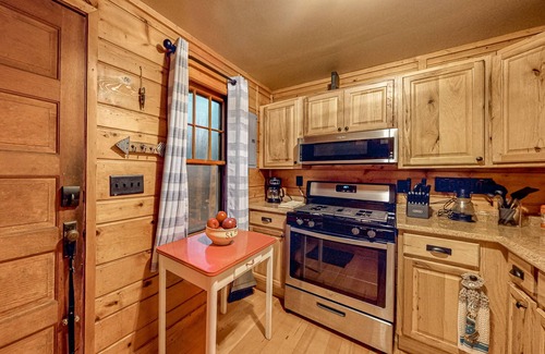 Three Lakes Cabin | Lakeside cabin with a firepit, sunroom, & seasonal dock