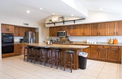 Avondale House | Large oasis, pool heater, spa, putting green