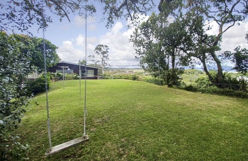 Ruakaka House | Large sunny home with stunning panoramic sea views of Bream Bay