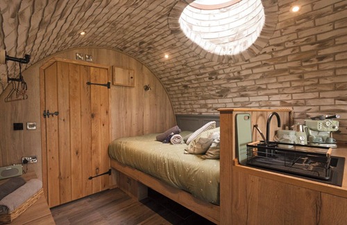 Falkirk Cabin | lily's Pad cabin, built into the side of a hill in the beautiful countryside