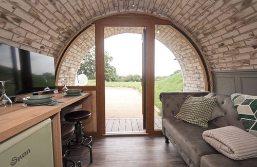 Falkirk Cabin | lily's Pad cabin, built into the side of a hill in the beautiful countryside