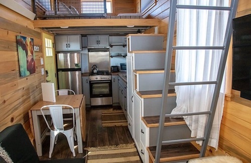 Meeker House | Lion Canyon was built by Mitchcraft in Fort Collins, Colorado as part of HGTV's "Tiny House Hunters". This home has two lofts, each with a Queen bed. One is accessible by stairs and one by ladder.