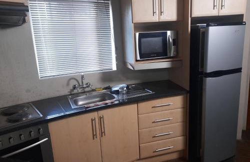 Lesotho Apartment | Liphofung cave, chalets