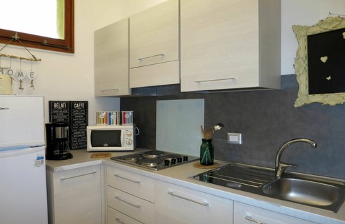 Brezzo di Bedero Apartment | Lovely apartment for 4 guests with WIFI, pool, TV, patio, pets allowed and parking