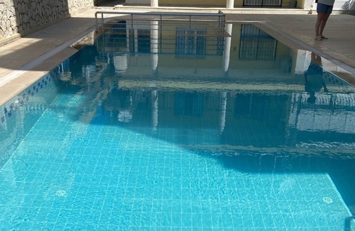Altinkum Apartment | Lovely ground floor apartment next to communal pool.10 minutes walk to the beach