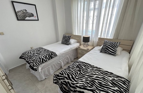 Altinkum Apartment | Lovely ground floor apartment next to communal pool.10 minutes walk to the beach