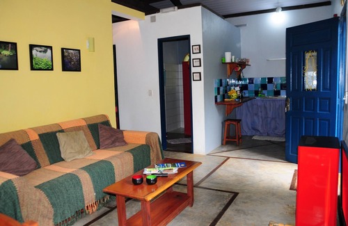 Paraty Cottage | Lovely little house in the woods, birds, trails and waterfall in the backyard.