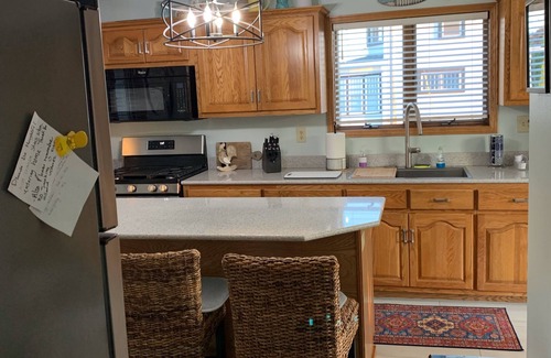 Two Rivers House | Lovely Riverfront views of river. Walking distance to beach. 🚴👙🐠