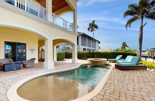 Siesta Isle House | Luxury home boasting waterfront views with pool and golf simulator