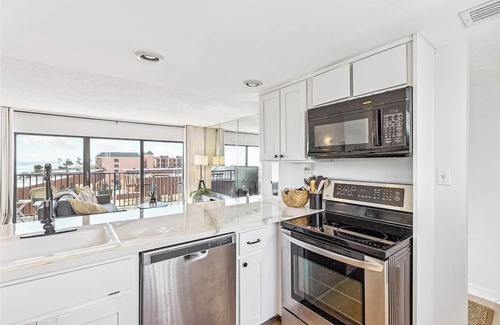 Avon By The Sea Condo | Luxury Oceanfront Getaway on the Top Floor Penthouse Corner Unit Steps from the Beach