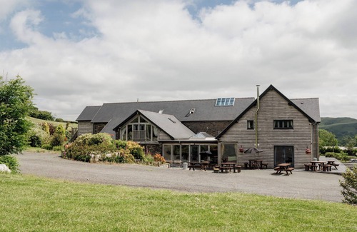 Devils Bridge House | Luxury renovated barn in the countryside with a large hot tub sleeping up to 38. Pets welcome