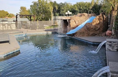 Canyon Gate Villa | Luxury Villa, with bonus pool house, Private Pool, Hot tub, rock water fall and slide, putting green, basketball, shuffle board, play gym, privately gated on circular driveway.