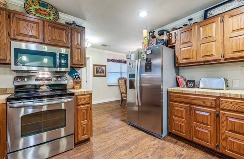 San Antonio House | Mini Resort In SA, 3 Master Suites w Heated Pool, big screen & outdoor kitchen