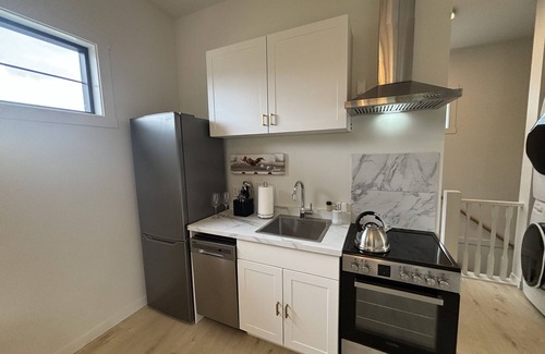 South Central Apartment | Modern 2BR Suite by the Beach | Walk to Hospital | Quiet & Bright Getaway