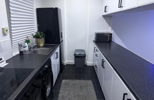 Cumbernauld Apartment | Modern 3-Bedroom Home with Cozy Cinema-Style Living Space