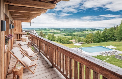 Frasdorf Apartment | Modern chalet style with private sauna, fireplace, hot tube, pool with Chiemsee view