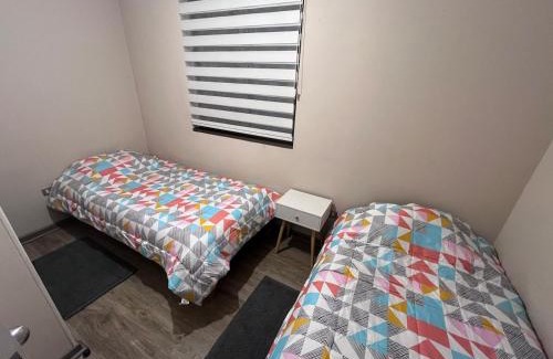 Coronel Apartment | Moderno departamento con WiFi, y estacionamiento en Coronel