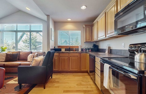 Ronald Condo | Mountain view condo with balcony, fireplace, pool, hot tub, gym & tennis
