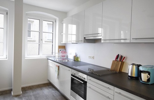 Insel Apartment | Müller vacation apartment - high-quality renovated old building with eat-in kitchen on the island