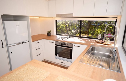 Nunderi Cabin | Nestled in Nunderi, this loft style tiny home offers a special retreat for two!
