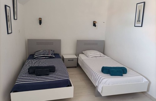 Quartier des Dunes Apartment | New duplex apartment, sea view with balcony in the center of town, private parking.