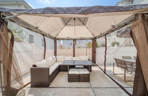 Newark House | Newark Gem Ruby 3BR, 3BA - Sleeps 14 - Walk to Prudential Center and Newark Penn Station, Near EWR and American Dream Mall, includes Parking - WiFi - Laundry - Backyard - Gym