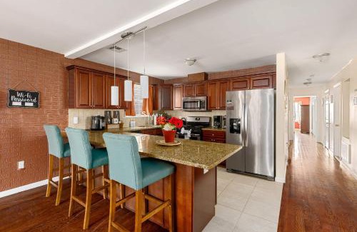 Newark House | Newark Gem Ruby 3BR, 3BA - Sleeps 14 - Walk to Prudential Center and Newark Penn Station, Near EWR and American Dream Mall, includes Parking - WiFi - Laundry - Backyard - Gym