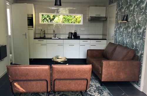 Bruinisse House | Nice, trendy furnished, vacation bungalow with fenced garden. Pets welcome!