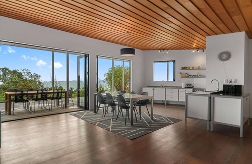 Langs Beach House | Oceanview Sanctuary - Modern, sunny holiday home with extensive decks and stunning views over Bream Bay