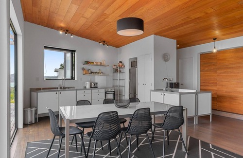 Langs Beach House | Oceanview Sanctuary - Modern, sunny holiday home with extensive decks and stunning views over Bream Bay