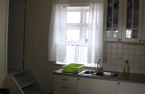 Eyrarbakki Cottage | Old house by the sea, Vulcan Hekla in front of the window, HG-00005951