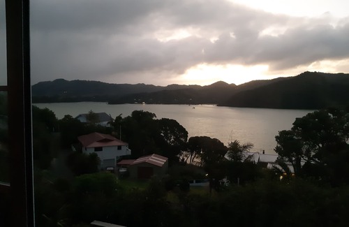 Whangaroa Ski Chalet | One Bedroom Unit with bathroom and small living area with kitchenette.
