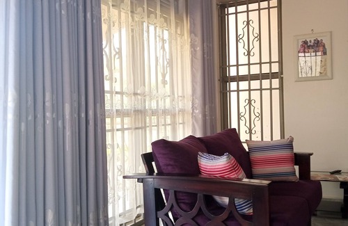 Mukono House | Out of town bungalow with a large green compound, trees and outdoor space