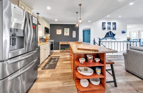 Holiday Isle House | Palm Breeze, boat dock and pool, pet friendly