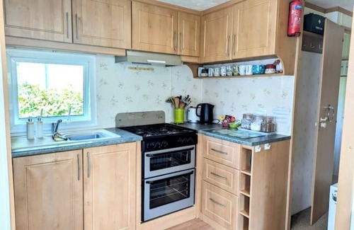 Bryn-crug House | Peaceful, woodland caravan site with pool and bar